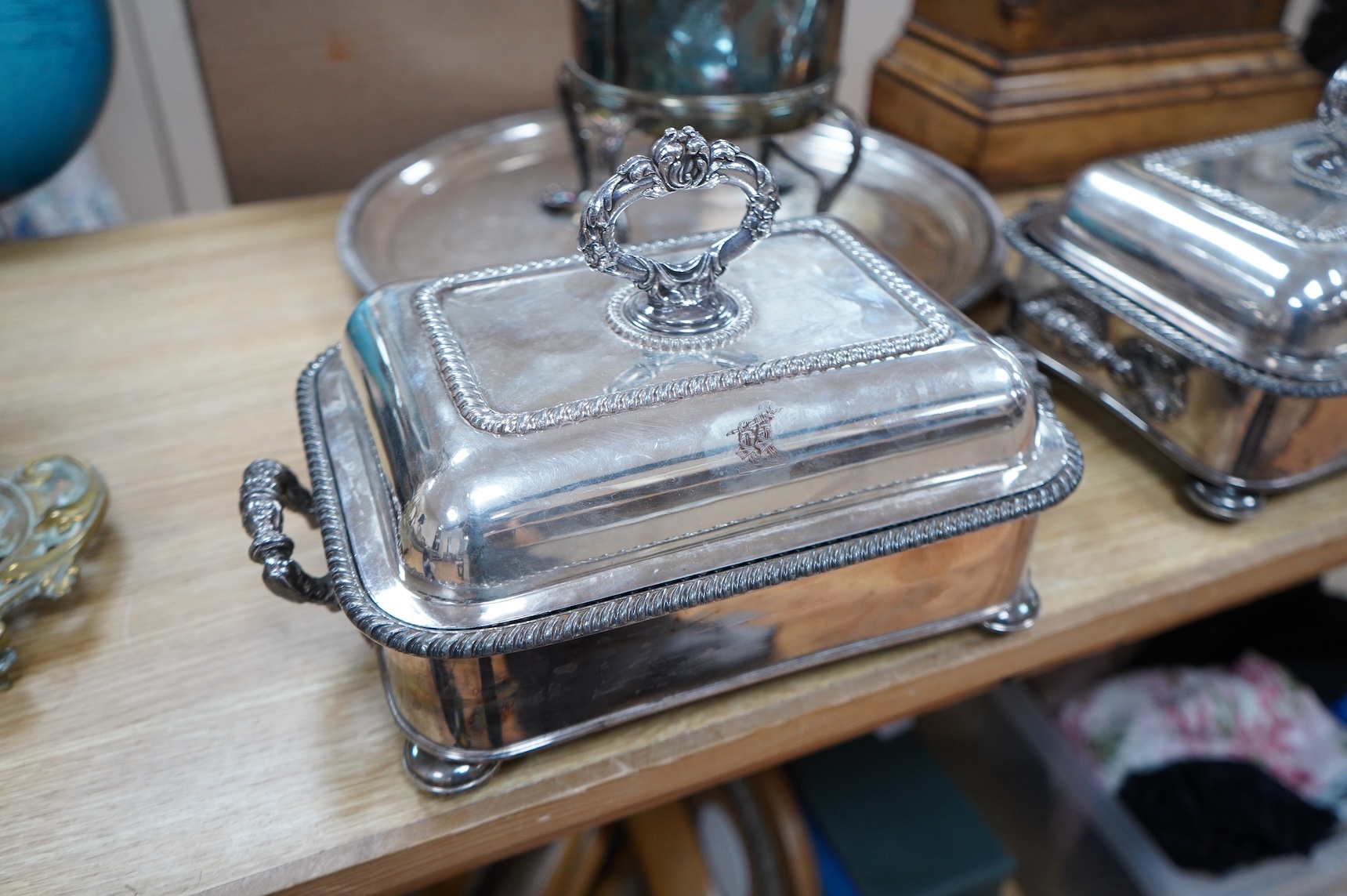 A pair of silver plated entrée dishes, an egg coddler and salver
